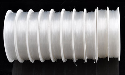 Bobine de +- 10mètres de fil nylon transparent de +- 0,8mm.d'épaisseur. Code: D09167 --- 10m. Fil nylon 0.8mm. Transparent---