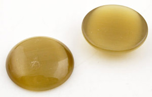 Demi perle pour collage en verre cateye, circulairee ± 27mm, ± 7mm gros. Couleur: Jaune foncé Code: D14317 --- Cateye, circulaire 27mm pour collage Jaune fonce---