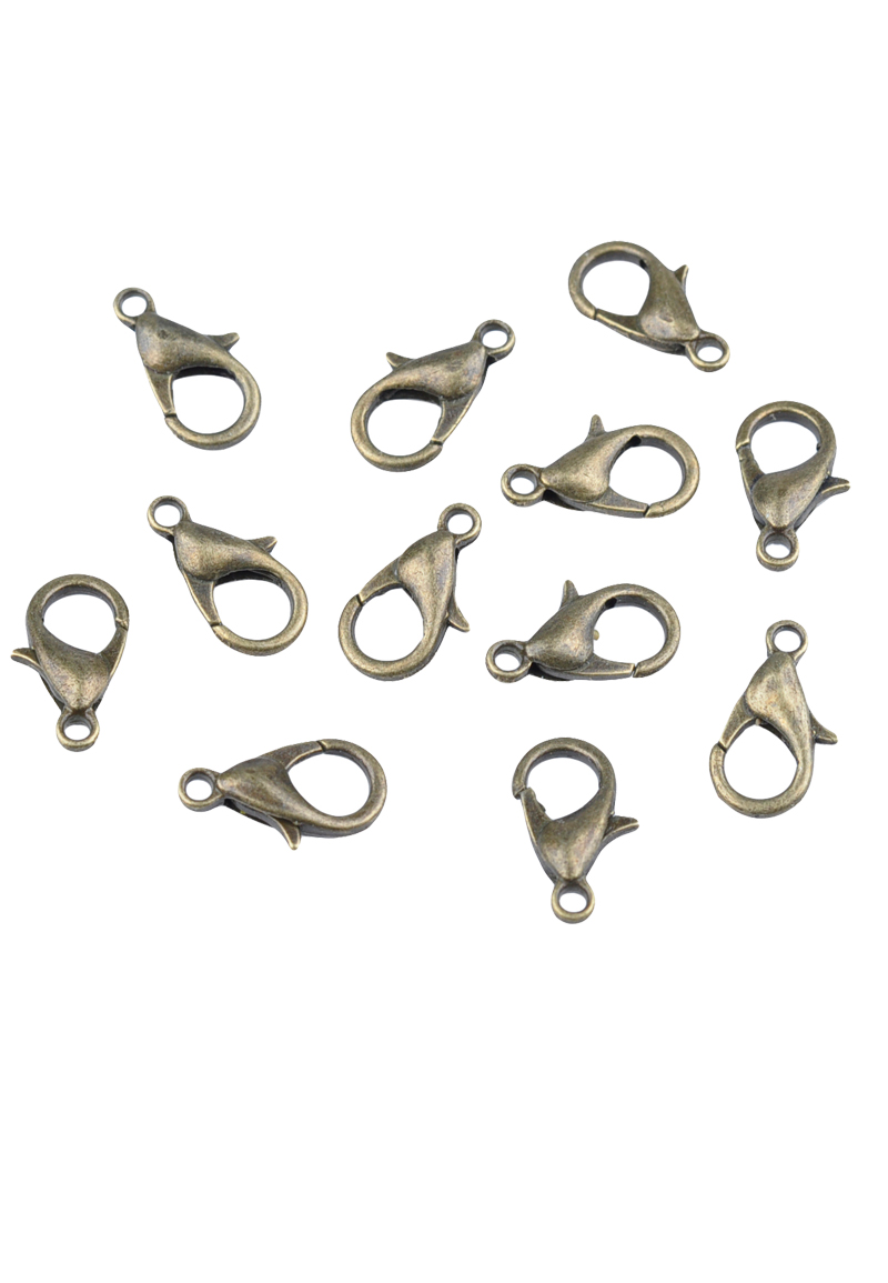 Fermoir en métal, ovales ± 12x7mm. Couleur: Couleur bronze vieilli Code: D17784 --- Fermoir metal, ovale ± 12x7mm Couleur bronze vieilli---