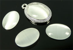 Cateye ovale coller 14x10mm. Blanc