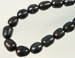 Perles eau douce +-10-14mm. Violet marron