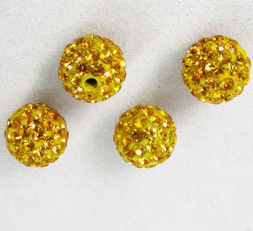 Superbe perle ronde scintillante de strass. Convient parfaitement pour les Shamballa. 10mm de diamètre. Couleur: Strass Jaune. Code: B81276 --- 10mm. Disco Ball Strass Jaune---