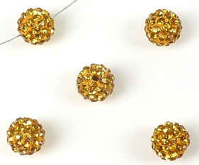 Perle en argile de Fimo avec des strass. De forme circulaire de +- 10mm.de diamètre. Perle de seconde qualité. Couleur Topaze Code: D13996 --- Fimo et strass, 10mm. Topaze---