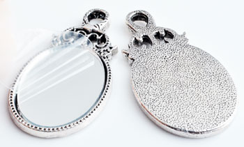 Code: D10035    --- Breloque miroir 54 x 28mm. Argent Vx.---