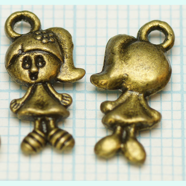 Pendentif, breloque en métal de couleur bronze . Dimension: +- 15 x 7mm œil compris. Couleur: Bronze antique Code: FILL001 --- Fille 15x7 bronze---