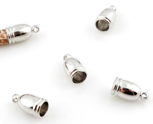 Calottes de métal ± 13x7mm (trou ± 5,5mm et oeil ± 1,5mm). Couleur: Nickel Code: D12227 --- Calotte metal 13x7mm. Trou 5,5mm. Nickel---