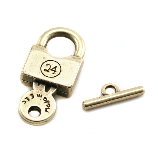 Fermoir en métal en forme de cadenas. Dimensions: +- 16x35mm.pour le cadenas et +- 3x20mm. Pour la barrette. Couleur: bronze clair Code: 1085892 --- Fermoir cadenas metal 16x35 + 3x21 Bronze Clair---