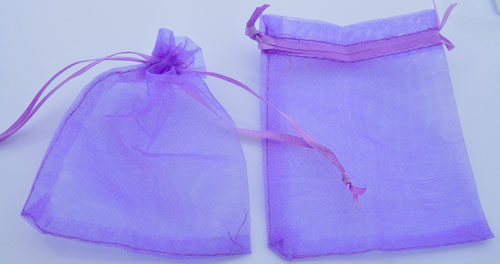 Sac en matière textile pour présenter petits bijoux. Dimensions: 120x90mm. Couleur: Lilas Code: D08866 --- Sac Textile 120x90mm. Lilas---