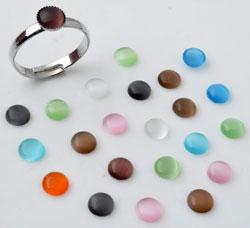 Sachet de 30 pièces de demi-perles Cateyes à coller. Mélange de diverses couleurs. Code: D11260 --- 30 Pcs. Cateyes 6mm. A coller---