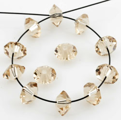 Code: D11507    --- Toupie 6x3mm. Golden Shadow---